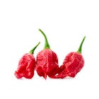 Travel News - Close-Up Of Carolina Reapers Over White Background