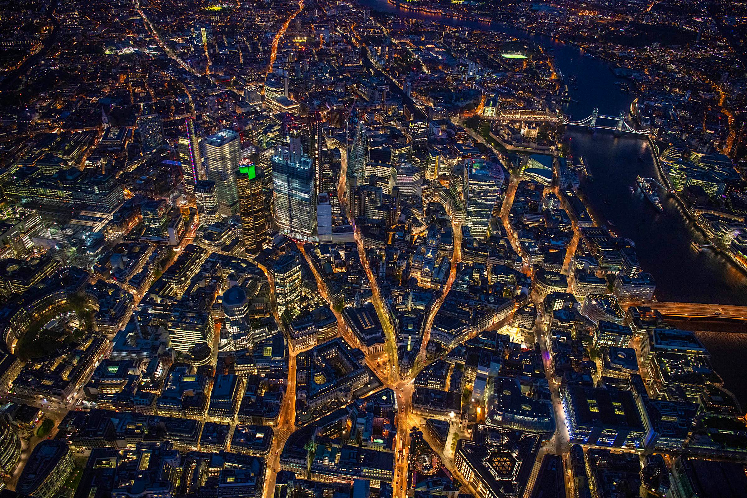 Travel News - Shot from 1900ft over the City of London and Bank at night. Travel News - Shot from 1900ft over the City of London and Bank at night.