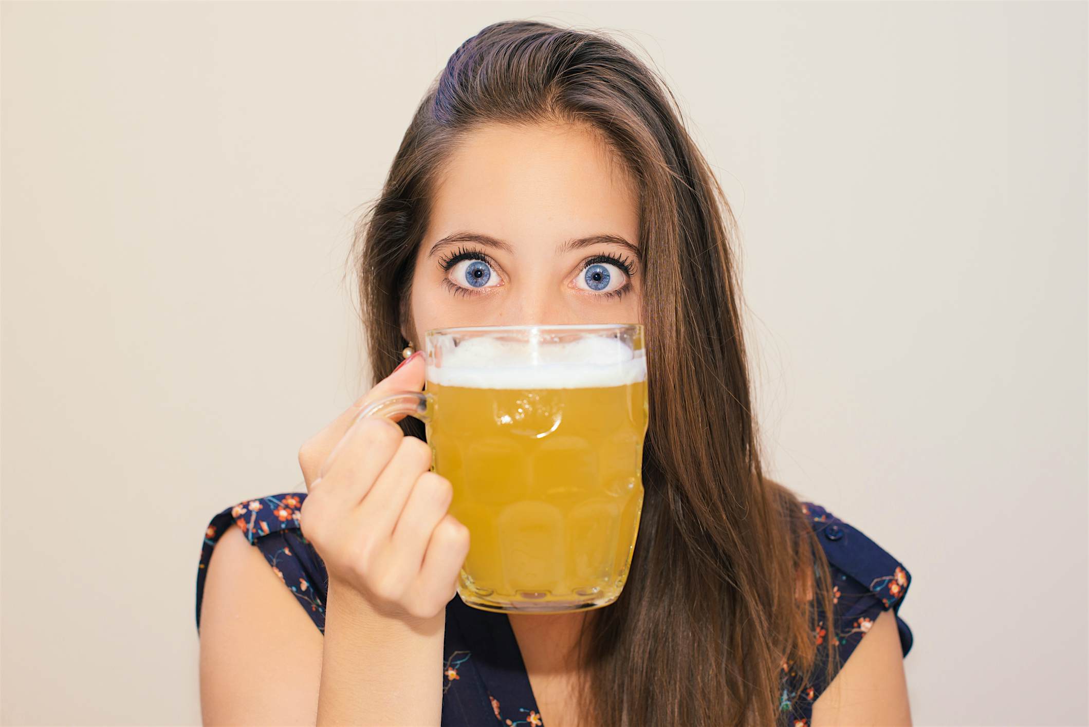 Travel News - Beautiful young woman drinking beer Travel News - Beautiful young woman drinking beer