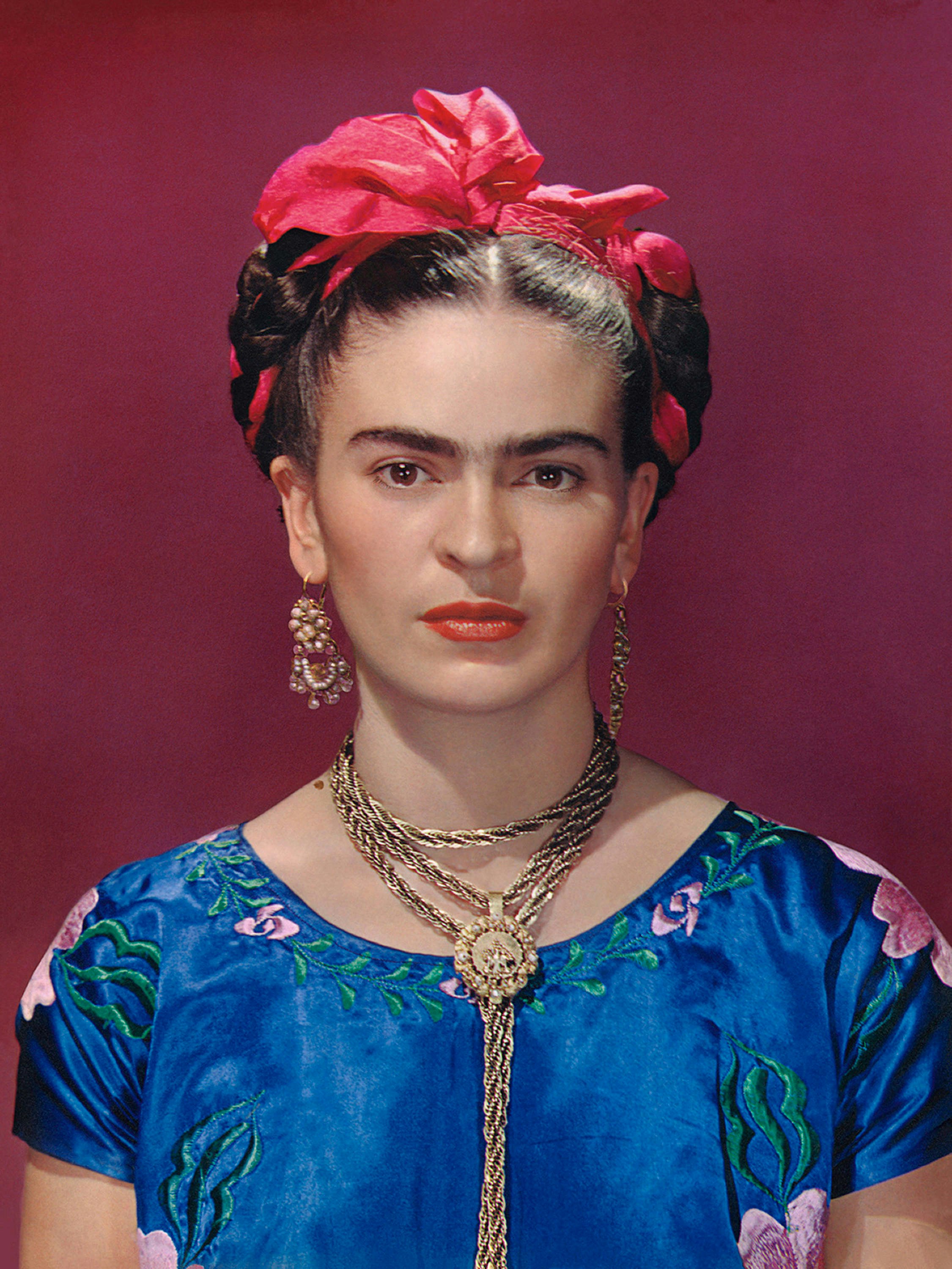 Travel News - Frida Kahlo in blue satin blouse, 1939. Photograph Nickolas Muray © Nickolas Muray Photo Archives