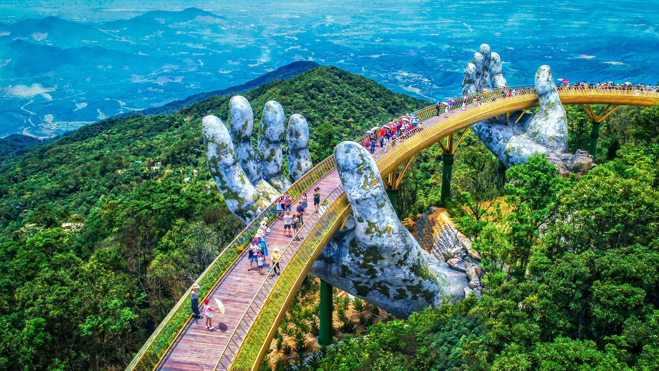 Enormous stone hands hold up Vietnam's new golden mountain bridge - Lonely Planet