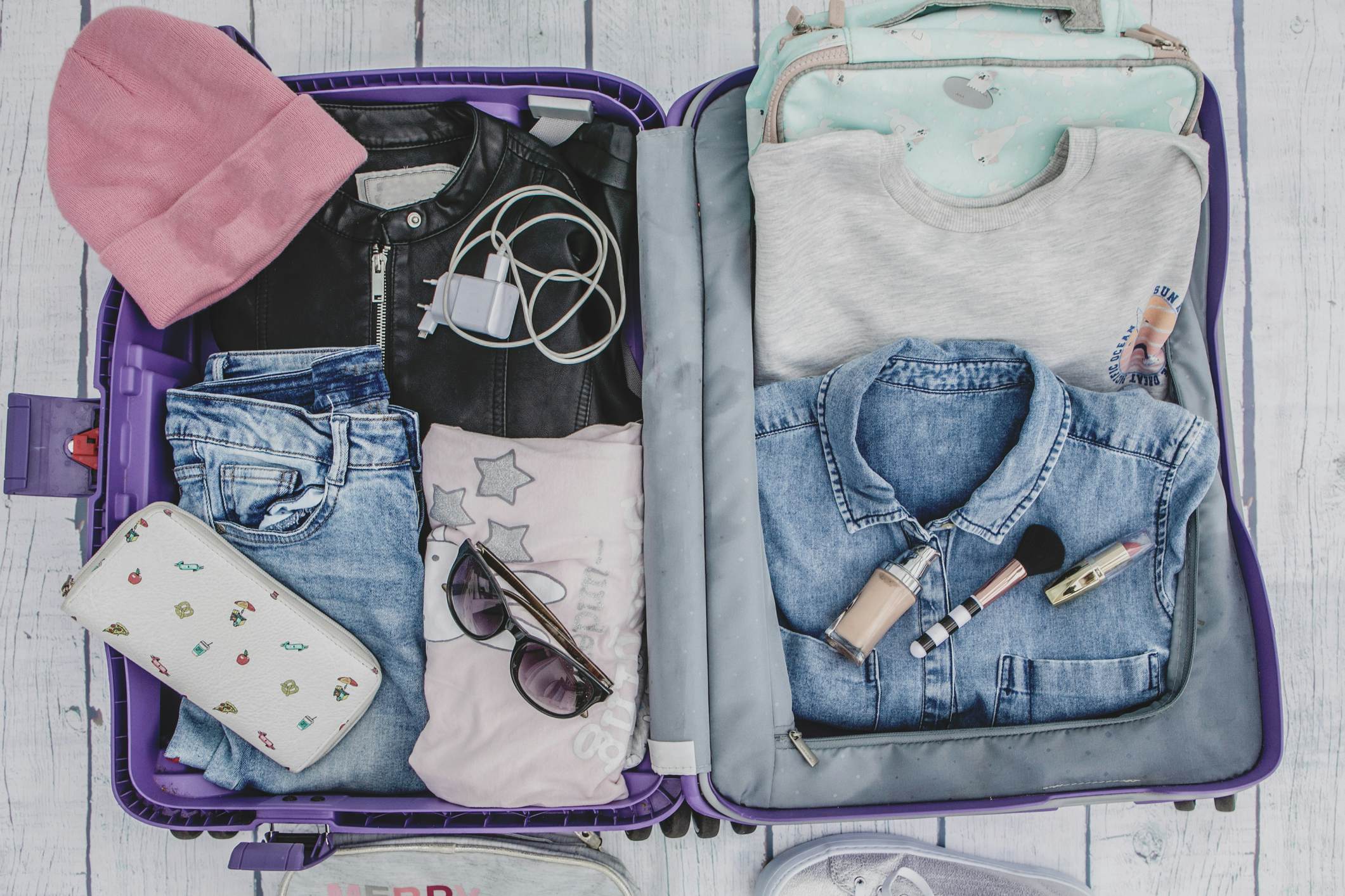 rolling clothes to pack in suitcase