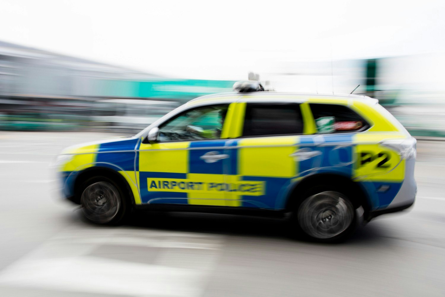 A blurred airport police car