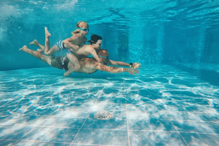 Travel News - Portrait Of Happy Family Swimming In Pool, Zakynthos Island, Greece