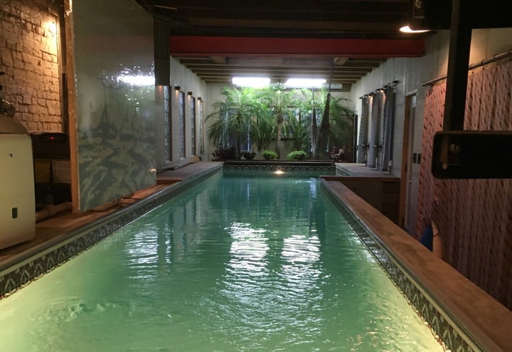 An indoor swimming pool in an ornate room