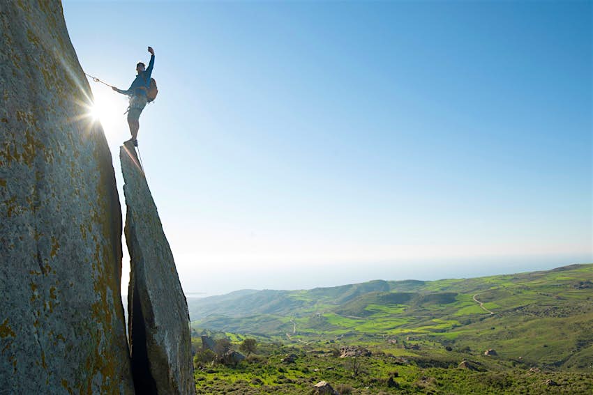 Travel News - Rock climber takes selfie portrait on ridge crest Travel News - Rock climber takes selfie portrait on ridge crest