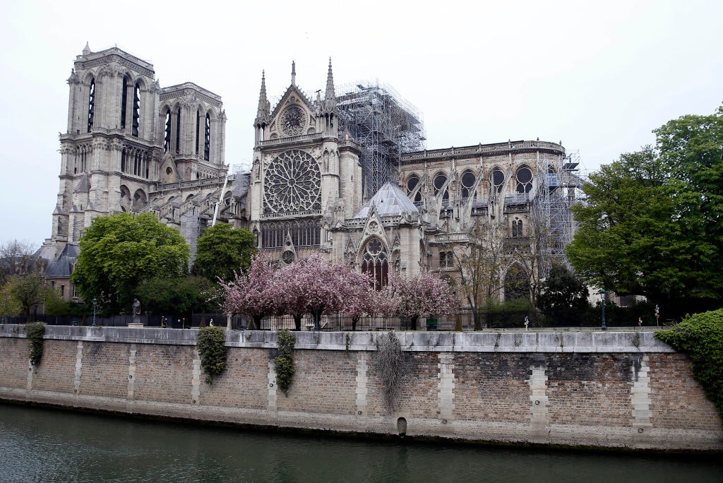 Notre Dame cathedral the day after the massive fire that ravaged its roof