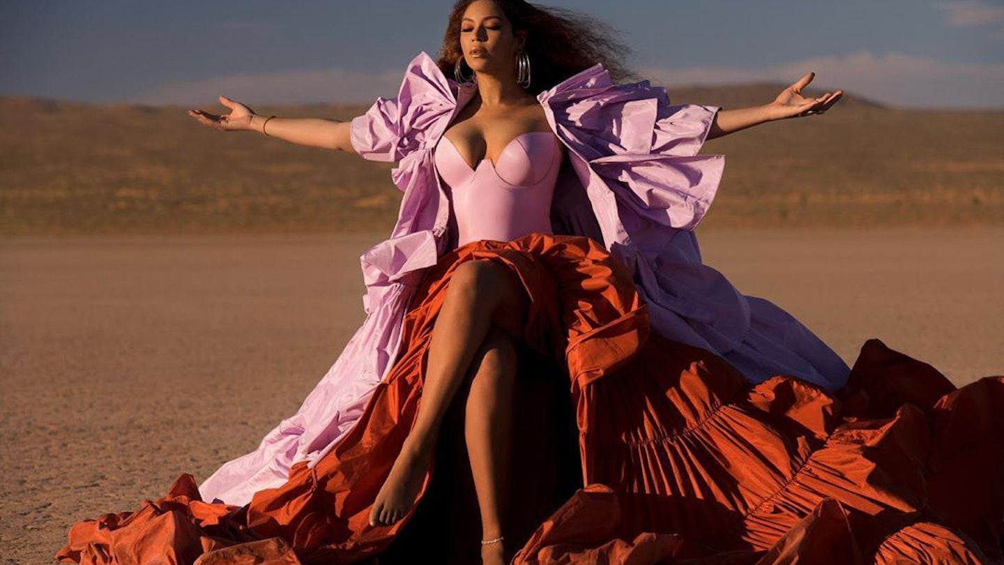 Beyoncé wearing a pink dress in the desert in Arizona