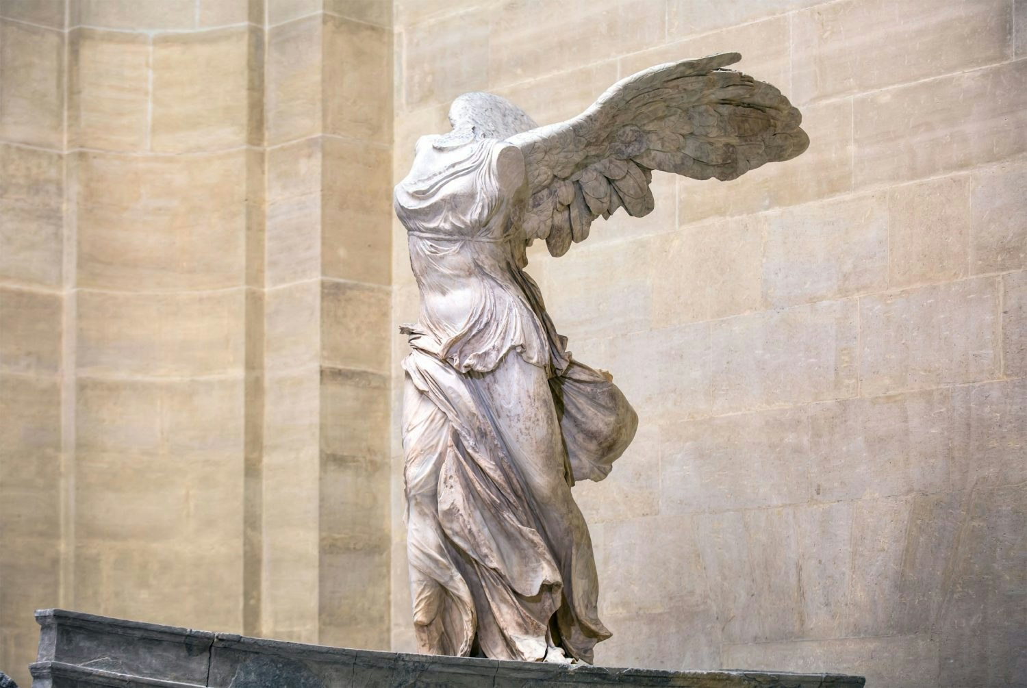 The Winged Victory of Samothrace, a marble sculpture in Louvre Museum.