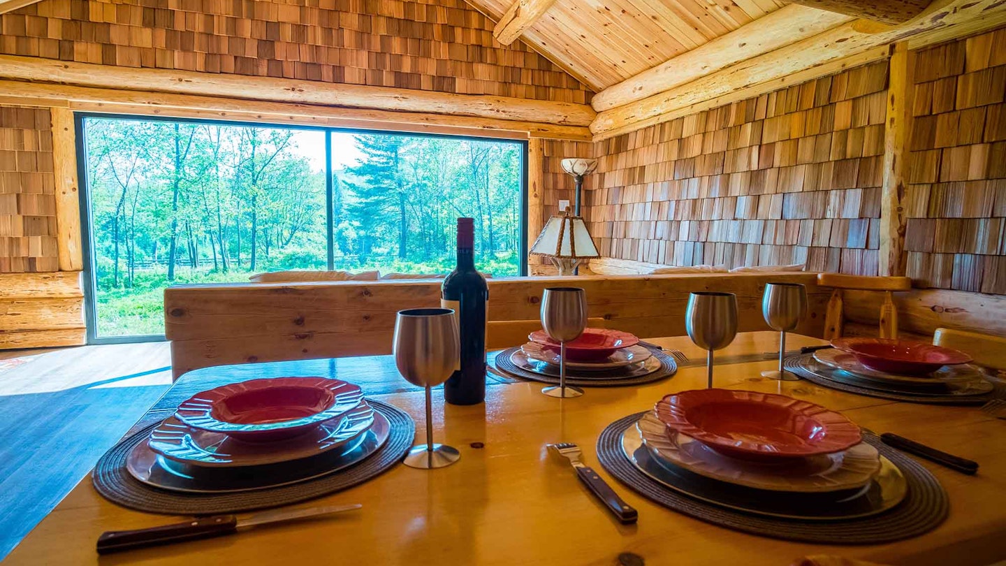 Experience this 'wolf cabin' at Parc Omega